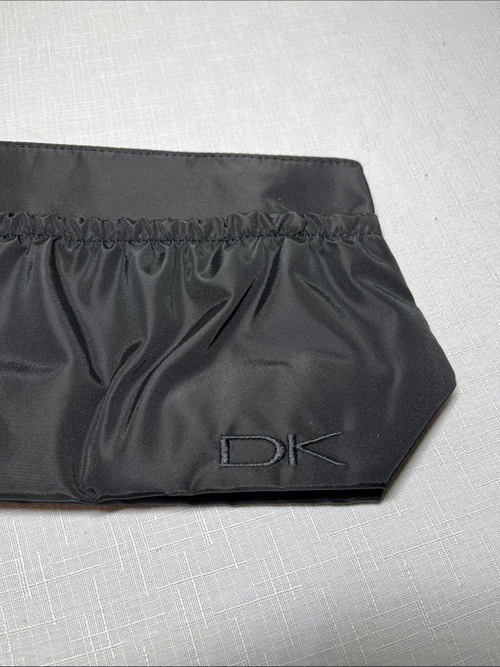 DK DONNA KARAN COSMETICS Black Satin Zip Pouch cosmetic bag. New.